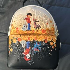 LOUNGEFLY Pixar Coco Marigold Mirror New. Never been used.